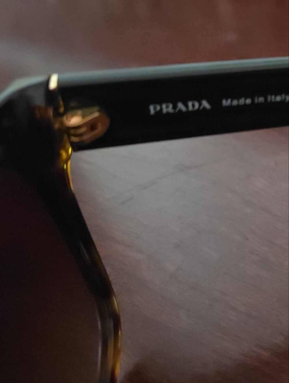 Prada Tortoiseshell Front with Black Temples Sunglasses